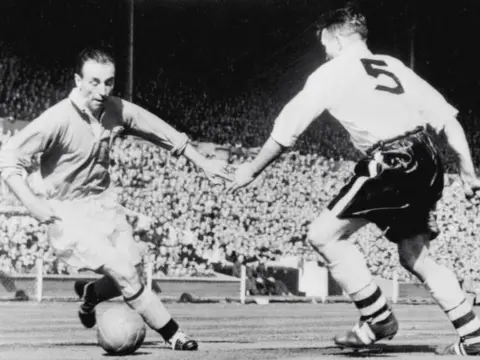PA Sir Stanley Matthews on the ball in The 1953 FA Cup Final