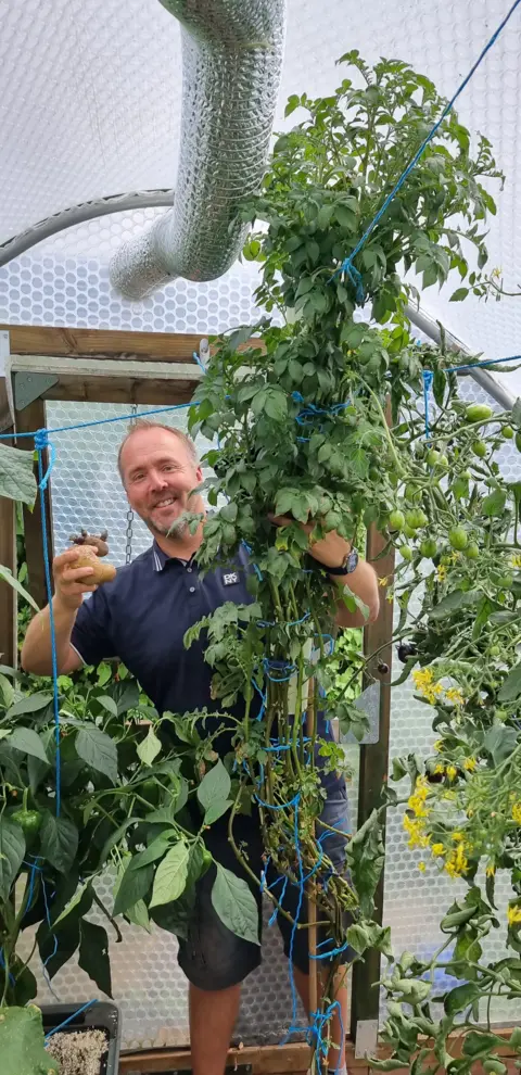 Kevin Fortey Kevin Fortey with potato plant