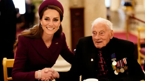 Princess of Wales with guests at a tea party for veterans