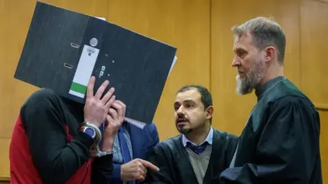 Taha al-J, IS member, appears in court