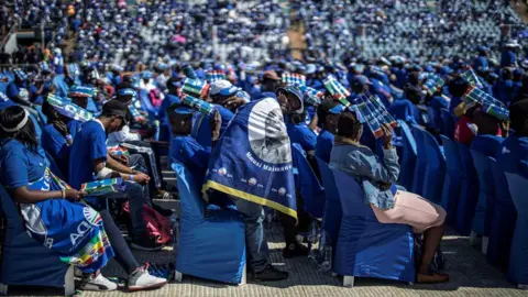 MARCO LONGARI A supporter reacts as the South African opposition party Democratic Alliance leader delivers his speech during the final presidential election campaign rally of the DA at the Dobsonville Stadium, in Soweto, Johannesburg, on May 4, 2019.