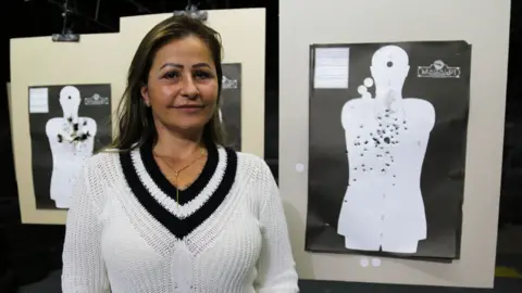 Katia Rose Maciel Broca at the gun club she is a member of