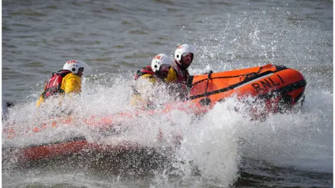 PA Media A photo of lifeboat crews