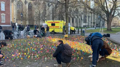 Planting flowers in memory of lives lost through drugs