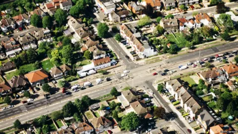 Urban Cow/Getty/iStock Aerial image of roads in a London suburb