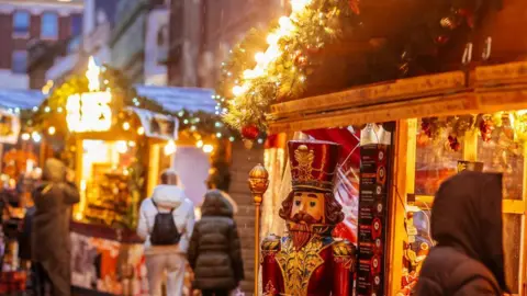 A statue of a soldier at a Christmas stall