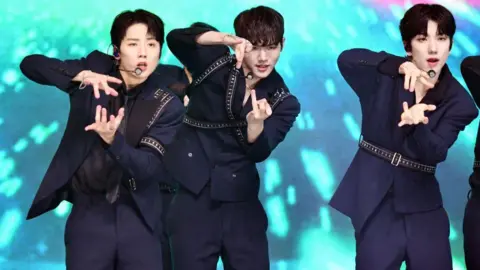 Getty Images (From left) Geonu, Bain, DY of JUST B attend the release showcase event for their first single album 'JUST BEAT' at Yes24 Live Hall on 27 October, 2021 in Seoul