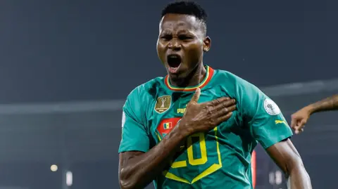 Senegal striker Habib Diallo pounds his chest in celebration after scoring a goal