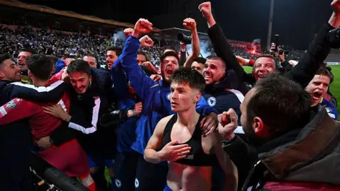 Bosnia-Herzegovina players celebrate beating Italy on penalties