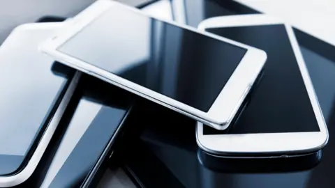 A pile of new smart phones