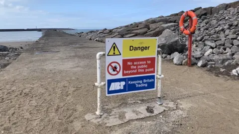 Danger sign at Aberavon beach