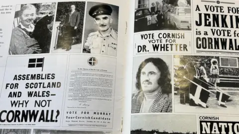 The inside of a magazine showing off various black and white pictures of notable Mebyon Kernow campaign adverts and photos of prominent party figures.