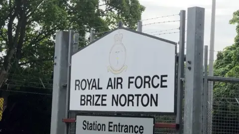 A close up of the sign of the entrance to RAF Brize Norton. 