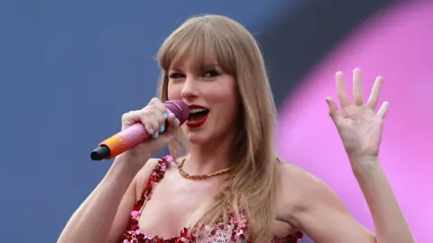 PA Media Singer Taylor Swift performing during the Eras tour