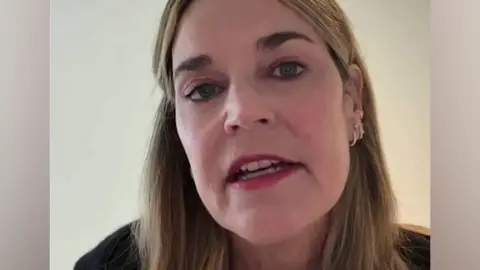 A screengrab of the new video released by Savannah Guthrie shows a close up selfie of her face as she speaks to camera.