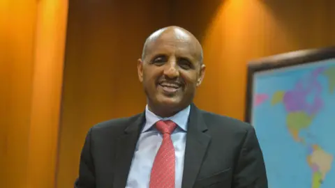 Tewolde Gebremariam, the new CEO for Air India, standing in a boardroom