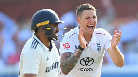 England bowler Brydon Carse celebrates taking a wicket