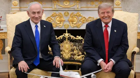 Maâayan Toaf (GPO)/Handout/Anadolu via Getty Images) Netanyahu and Trump smile towards the camera during their meeting at the White House