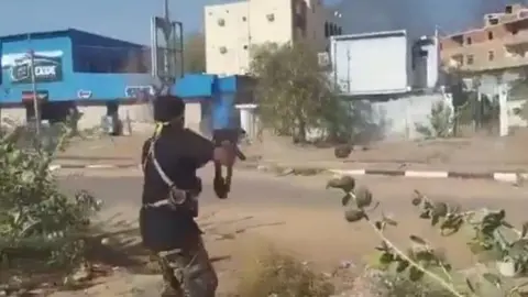 Man firing at RSF fighter trying to escape on a motorcycle