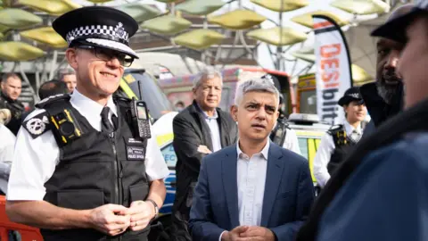 PA Media Sir Mark Rowley and Sadiq Khan meeting Stratford officers and residents in October
