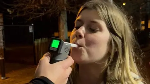 A youngster being breathalysed