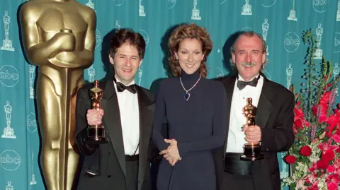 Getty Images James Horner, Celine Dion dhe Will Jennings në Academy Awards 1998