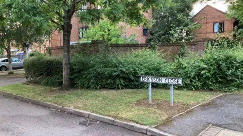 Martin Heath/BBC Residential street in new housing estate with "Ericcson Close" sign