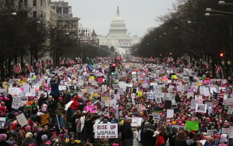 Getty Images Protesters walk during the Women's March on Washington, with the U.S. Capitol in the background, on January 21, 2017 in Washington, DC