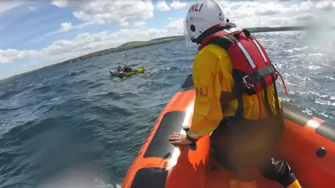 Macduff RNLI RNLI lifeboat going to kayakers