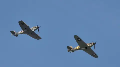 Spitfire and Hurricane aircraft fly next to each other