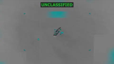 Reuters A vessel outline is shown in black and white under the word "unclassified" in a screen grab taken from a video released on 14 October 2025