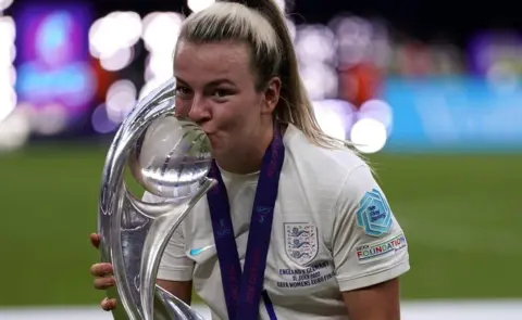 PA Media England's Lauren Hemp celebrates with the trophy following victory over Germany in the UEFA Women's Euro 2022 final at Wembley Stadium, London