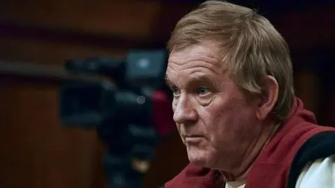 AFP Peter Frederiksen sits in court in 2018