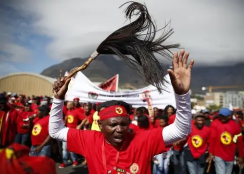 EPA South African workers march as they embark on a nationwide protest against a proposed minimum wage in Cape Town, South Africa 25 April 2018.