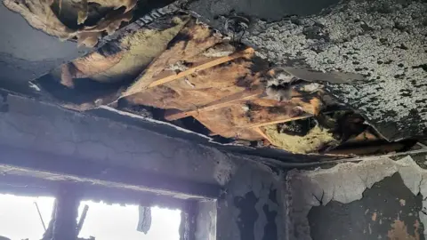 Graham Nicholls Ceiling damaged by fire