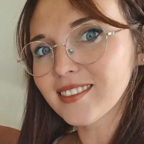 Lucy Greenstreet Lucy Greenstreet. She has long brown hair and thin framed large glasses. 