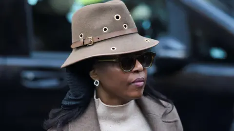 Nigeria’s former Petroleum Minister Diezani Alison-Madueke arrives at Southwark Crown Court. She is wearing dark glasses and a hat.