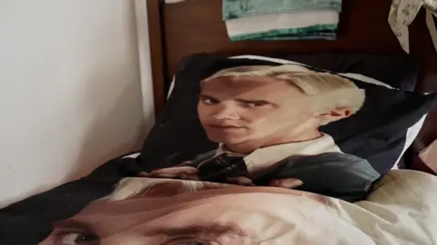 A pillow lawsuit  with an representation  of Draco Malfoy