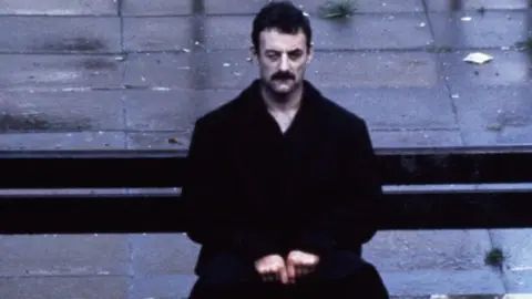 Yosser Hughes (portrayed by Bernard Hill) in the BBC drama series Boys from the Blackstuff which depicted the despair of unemployment