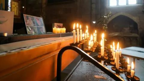 PA Media Candles at Shrewsbury Abbey