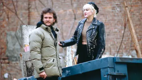 Getty Images American singer and actress Madonna with director James Foley on the set of the film 'Slammer', later titled 'Who's That Girl?', USA, 1987