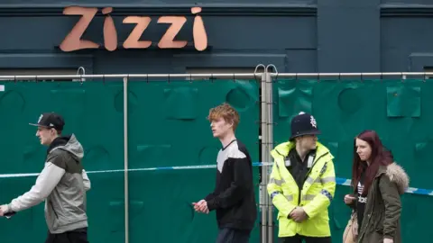 Getty Images Police officers continue to stand guard outside the Zizzi restaurant in Salisbury, as police and members of the armed forces continue to investigate the suspected nerve agent attack on Russian double agent Sergei Skripa on March 12, 2018 in Wiltshire, England.