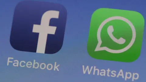 Getty/Justin Sullivan WhatsApp and Facebook logos on a phone