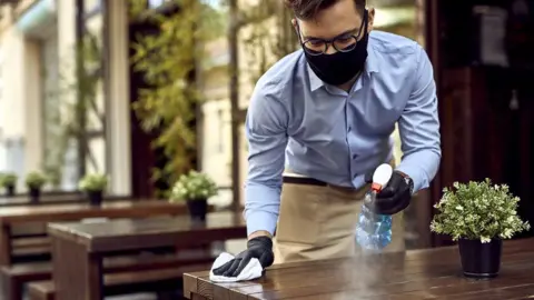 Getty Images A waiter