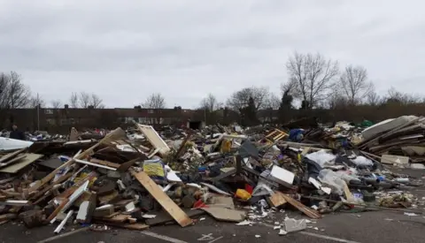 Harrow Council Piles of rubbish inside a derelict car park