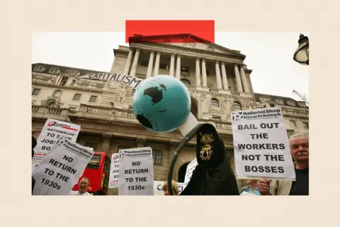 Getty Images A grim reaper figure holds a globe pierced by a scythe in front of the Bank of England during a protest on October 13, 2008 in London
