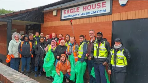 Charlie Watts Knowle West residents after a recent clean-up standing outside Eagle House Community Association
