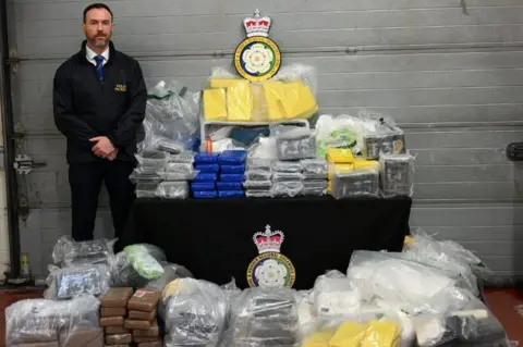 West Yorkshire Police Detective Chief Superintendent Carl Galvin of the YHROCU with the seized drugs