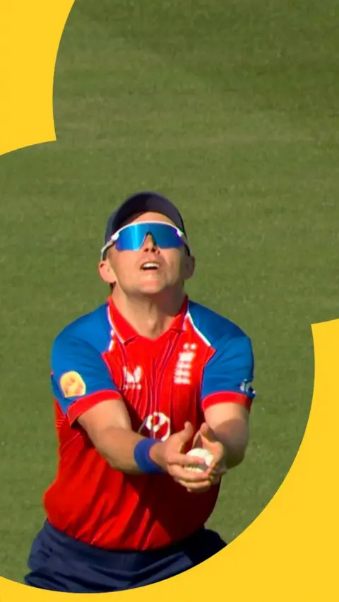 Sam Curran catching a ball as England play India in the men's international T20.