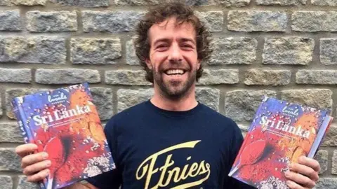 Immy Sunshine Jon with his cookbooks